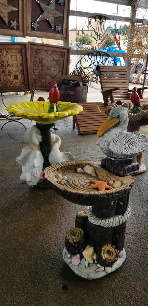 Painted cement pelican birdbath.