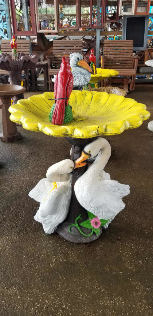 Colorful swan birdbath.