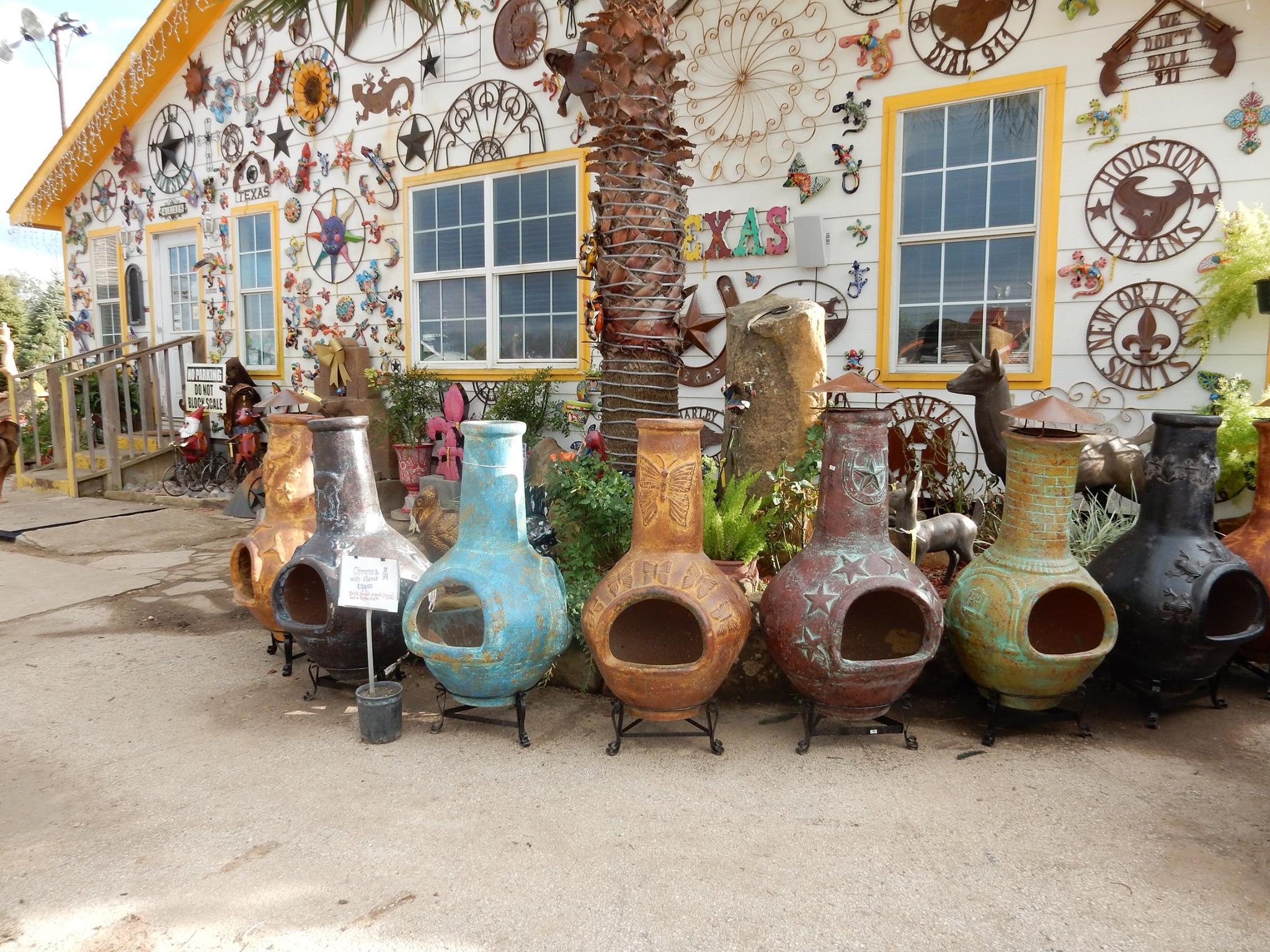 Yard decorations like pottery and metal decorations at J&J Nursery, Spring, TX.